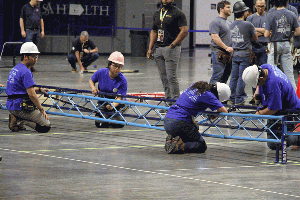 UNO engineering students work on their steel bridge, which earned first place at the ASCE 2023 symposium in March.