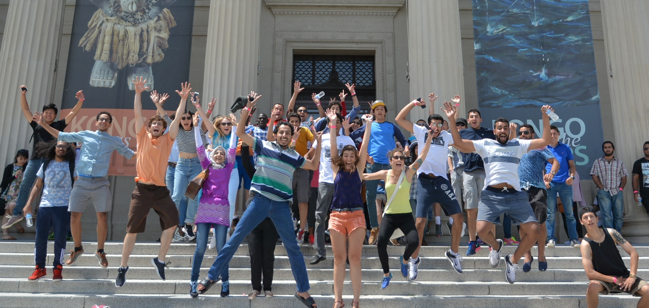 Students jumping on the steps at NOMA