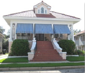 Landscaping, awnings and wide set staircase disguise elevation. Elevation about 10 feet.