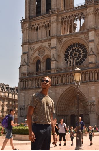 Student standing in front of Notre Dame