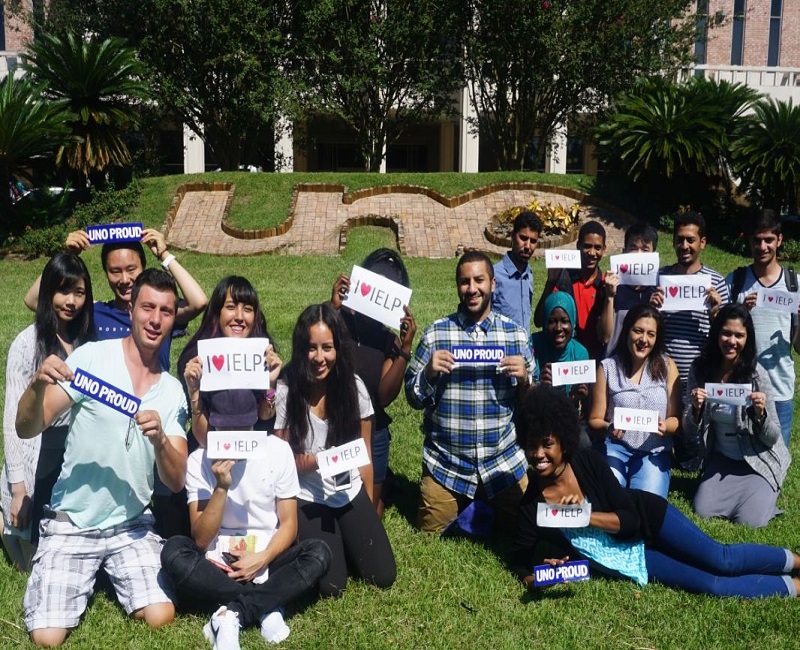 Students holding IELP signs at University Center
