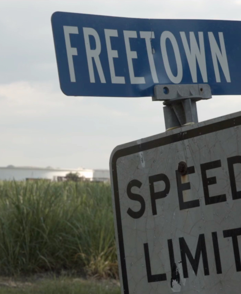 Street Sign for "Freetown Rd" in Front of a Chemical Plant