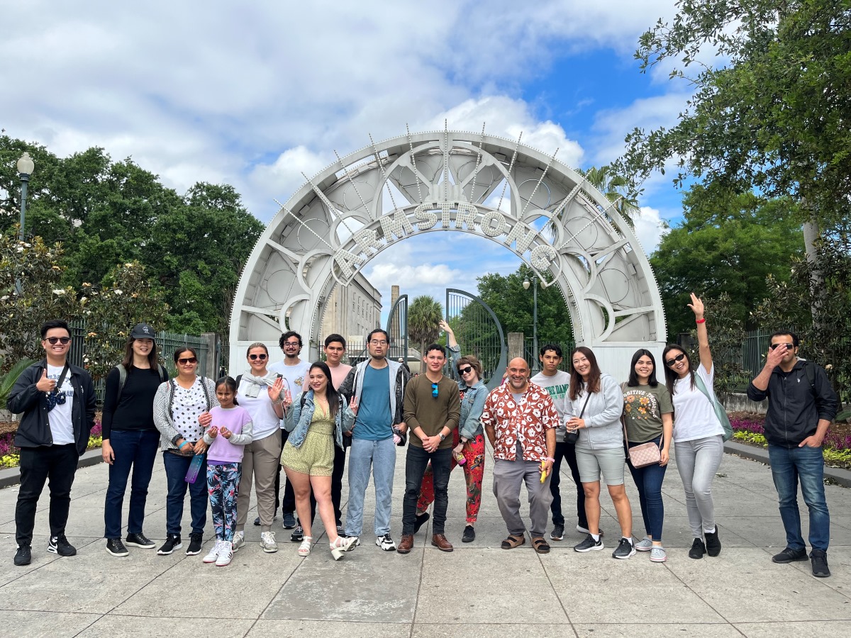 Students standing in front of Louis Armstrong Park