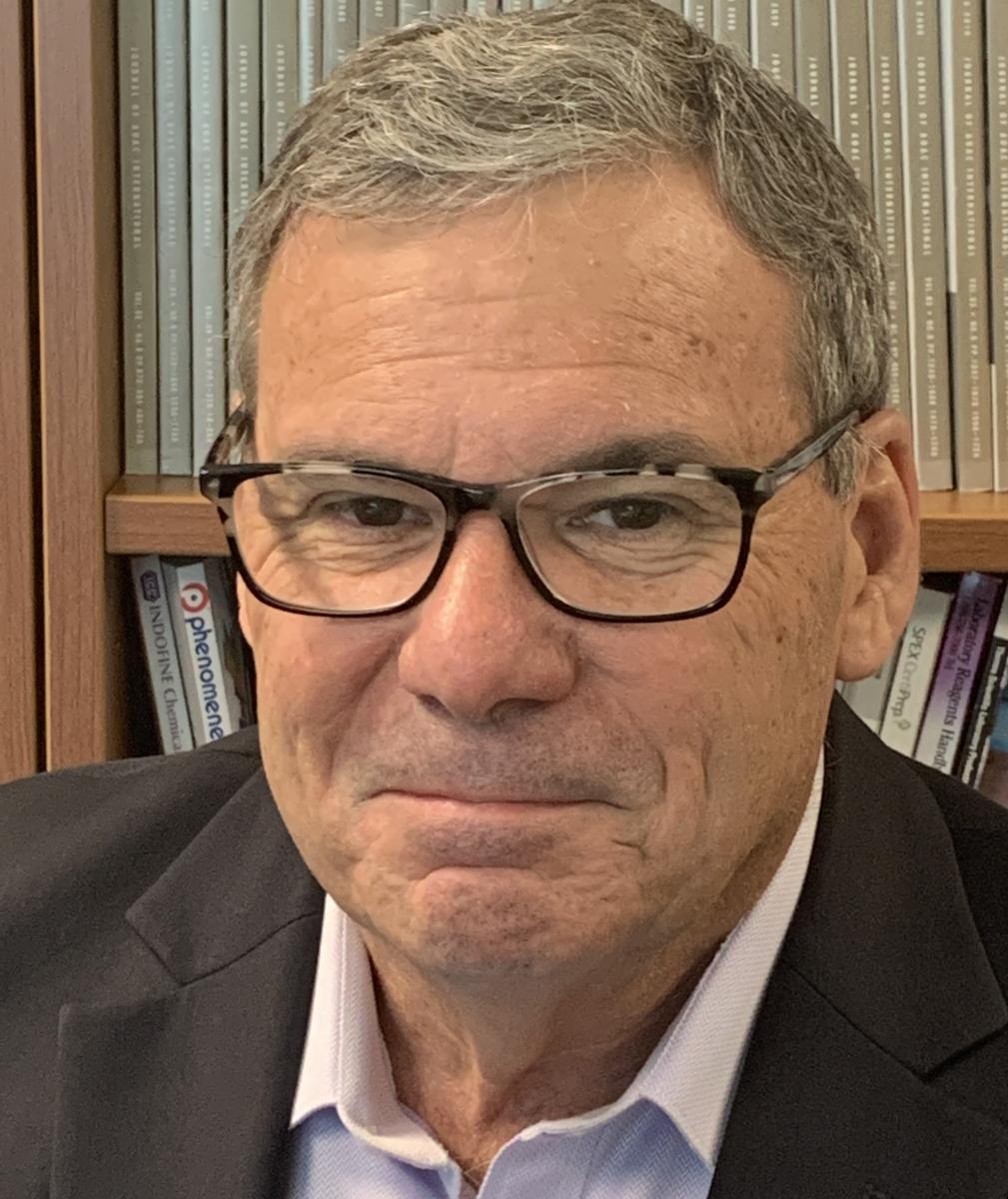 Headshot of John Reuther