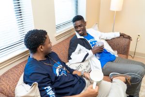 Students talking in Living Room