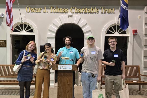 Five UNO students stand in front of the Oscar J Tolmar Charitable Trust center
