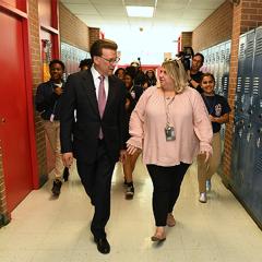 University of New Orleans alumna Jennifer Williams and Milken Educator Awards founder Lowell Milken.