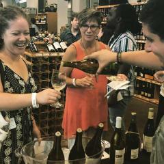 Attendees enjoy a wine tasting 