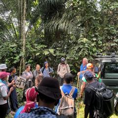 University of New Orleans biology professor Nicola Anthony, far left in blue, conducted research in Gabon, Africa as part of a field training school. This photo was taken in front of the mayor’s office in Lastourville. 