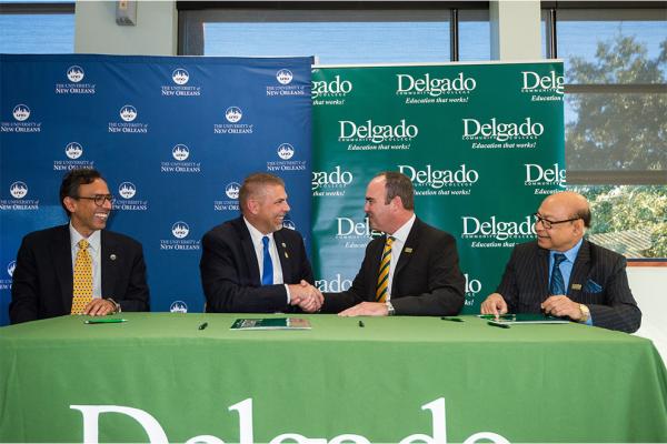 (l-r) Mahyar Amouzegar, UNO provost and senior VP academic affairs; UNO President John Nicklow; Delgado Interim Chancellor William Wainwright; and Mostofa Sarwar, Delgado interim vice chancellor of academic affairs and provost, at the Jan. 24 signing ceremony. 