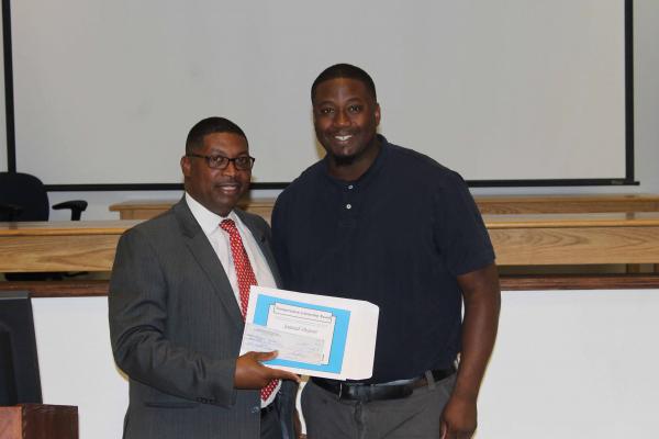 Junior Jamaal Dejean (right) received a $1,000 scholarship from state transportation leaders. He is pictured here with Louisiana DOTD Secretary Shawn D. Wilson.