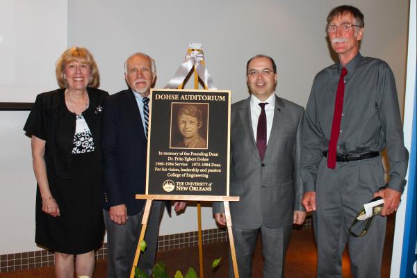 From left to right: Helen Holzenthal, Associate Dean Kim Jonvanovich, Dean Taskin Kocak, Till Dohse stand by the plaque dedicating the auditorium to Fritz-Egbert Dohse. 