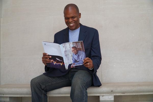 Novelist and University of New Orleans alumnus Maurice Ruffin has his copy of the spring 2019 issue of Silver & Blue magazine.  