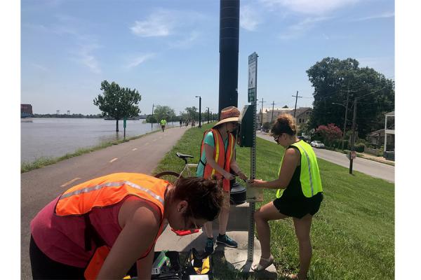 Tara Tolford (right), research associate in the University’s Transportation Institute, was awarded $248,000 to collect and study data on bicyclists and pedestrians. She and research assistants Marin Tockman and Antonia White-Barstow install a counter.