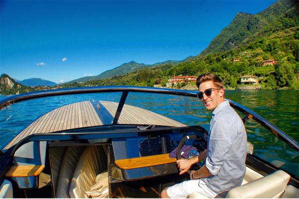 University of New Orleans student Nigel Watkins is at the wheel of a Vita Yacht in Lago Maggiore, Italy. 