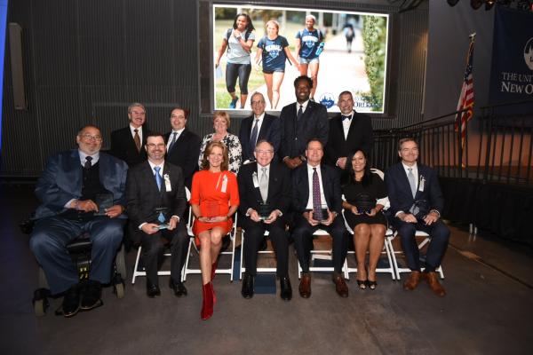 (Honorees seated from left)  Timothy Adams, Riley Parker, Jan Aronson, Dr. Fred Rodriguez, Randy Bush, Roxanna Rodriguez-Torres and Phillip May.