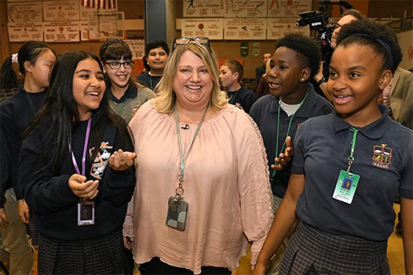 University of New Orleans alumna Jennifer Williams received a Milken Educator Award during an assembly at John Q. Adams Middle School in Metairie where she teaches. (Photo courtesy of Milken Family Foundation)