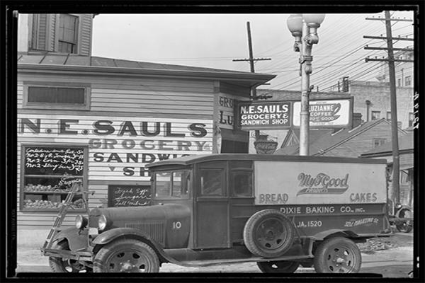 The Midlo Center for New Orleans Studies is creating a new oral history project focusing on family businesses in New Orleans. A New Orleans street corner is pictured circa 1936. (Walker Evans, Library of Congress). 