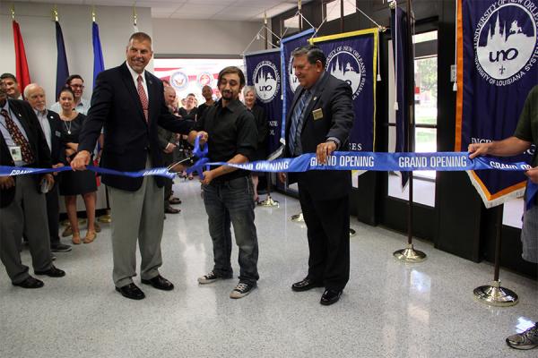 UNO President John Nicklow, student Miguel Olivero and Col. Joey Strickland, secretary of the Louisiana Department of Veterans Affairs, participate in a ribbon-cutting to open UNO’s Veterans Service Center in 2017. 
