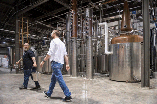 New Orleans distilleries, including Porchjam, are getting scientific help from UNO researchers as distilleries pivot to producing hand sanitizers. Pictured are Porchjam’s Jason Zeno and Gordon Stewart. (Photo courtesy of NOLA.com)