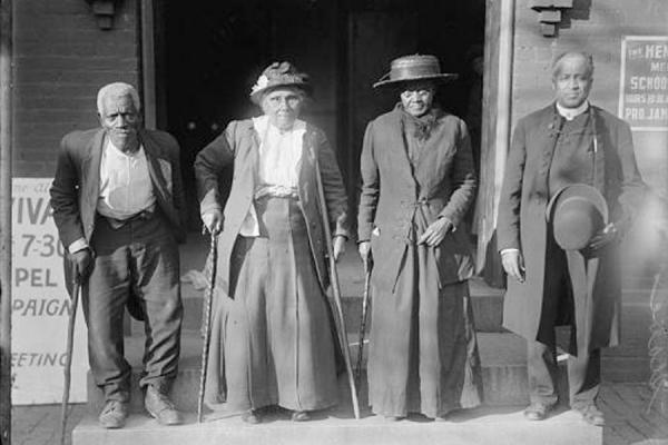 Four attendees at the convention of formerly enslaved people held in 1916 in Washington, D.C.  (L-R) Lewis Martin, Martha Banks, Amy Ware, and Reverend S.P. Drew, who was born free. (Library of Congress)