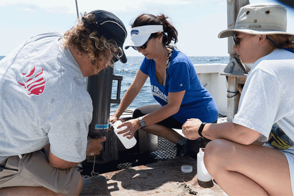 UNO biologist T. Erin Cox and members of her lab take water and sediment samples from artificial reefs off the coast of Alabama. 