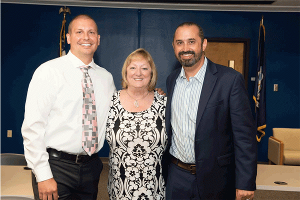 Max Krochmal (far right) is the new director for the doctoral justice studies program at UNO. He’s pictured with outgoing program coordinator Steve Mumford (left) and professor Kim Martin Long. 