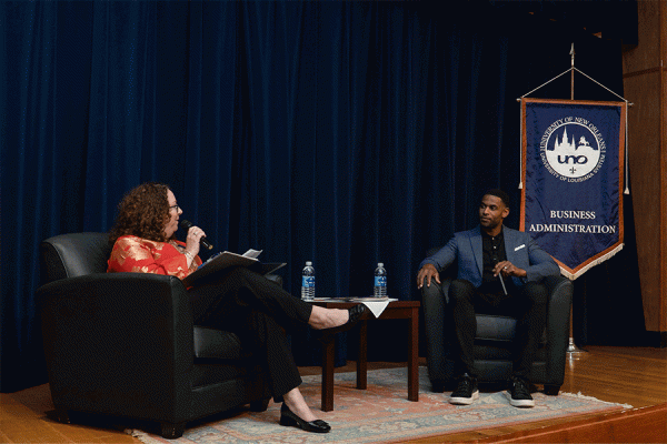 Former New Orleans Saints star receiver Marques Colston, who has developed several businesses, chats with Pamela Kennett-Hensel, dean of UNO’s College of Business Administration.