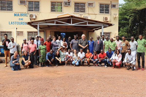 University of New Orleans biology professor Nicola Anthony, far left in blue, conducted research in Gabon, Africa as part of a field training school. This photo was taken in front of the mayor’s office in Lastourville. 