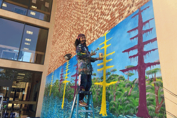 The outdoor artistry on the Education Building is at the hands of three guest muralists from Guerrero, Mexico, known collectively as Raiz de la Ceiba or Root of the Ceiba Tree. The trio are working on two murals on UNO’s campus.