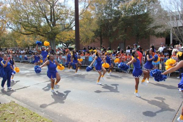 Cheerleaders from Sophie B Wright Academy parade in Krewe of UNO