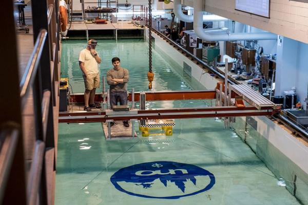 Stock photo of UNO students working at the tow tank