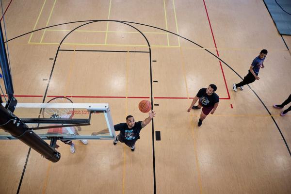 Photo of students playing basketball